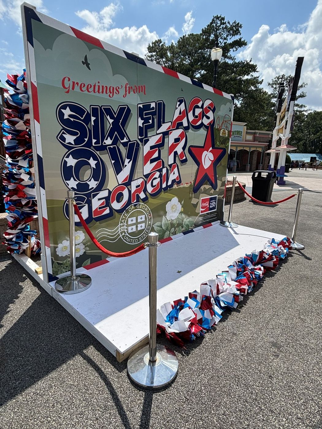 Coca-Cola x Six Flags activation signage at a theme park entrance
